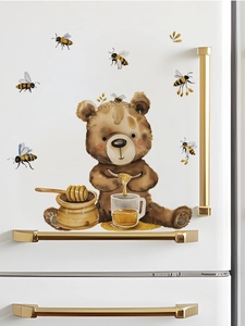 Close-up of watercolor honey bear and bees wall stickers on a white refrigerator