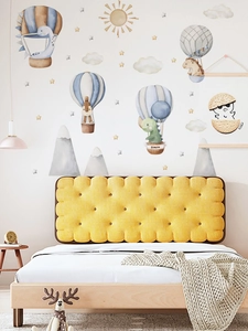 Detail of cartoon dinosaur hot air balloon wall stickers in a cozy bedroom setting