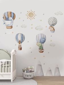 Detailed watercolor dinosaur and hot air balloon wall decals in a cozy nursery room decor