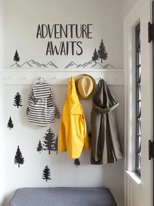 Detail of Adventure Awaits wall decal with pine trees and mountain silhouettes