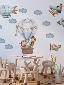 Watercolor animal hot air balloon wall stickers shown in a cozy nursery room setting