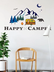Detail of camping theme wall stickers with tent, pine trees, and stars on white wall