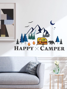 Detail of Happy Camper wall decals with mountain, bear, and campfire on living room wall