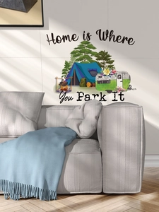 Detail showing 'Home is Where You Park It' camping scene wall sticker in a cozy living room
