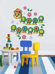 Detail of colorful caterpillar wall decals with numbers 1-10 in a kids bedroom