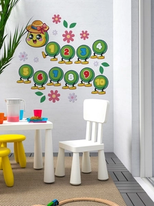 Close-up of cute green caterpillar wall decals with numbers 1 to 10 for kids room