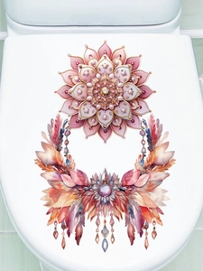 Adesivo mandala rosa con piume e ciondoli applicato su un coperchio del water bianco