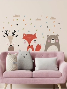 Close-up of cute cartoon fox, bear, and deer wall stickers with stars for nursery decor