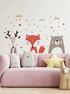Nursery wall decals featuring cartoon deer, fox, and bear above a pink sofa