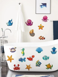 Close-up of ocean animal bathroom stickers with crab and octopus designs on white bathtub