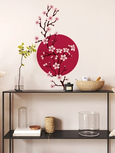 Detail of Zen style wall decal with cherry blossom branch and red sun in a living room
