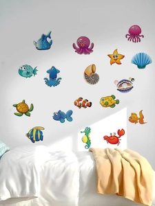 Detail showing 17 cute cartoon sea creature wall stickers on a clean white bedroom wall
