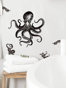 Detail of vintage black and white octopus wall decal in a minimalist bathroom setting