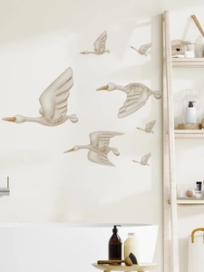 Close-up of elegant 3D flying birds wall decor with textured details and cream finish