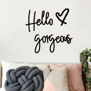 Hello Gorgeous wall sticker in black artistic script with heart on a white wall decor