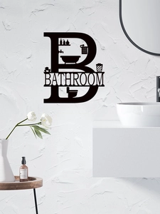 Detail der schwarzen Badezimmer-Wanddeko mit Badewannen-Silhouetten auf weißer Wandfläche