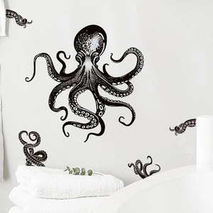 Minimalist black octopus wall decal art on a clean white bathroom wall with green plants