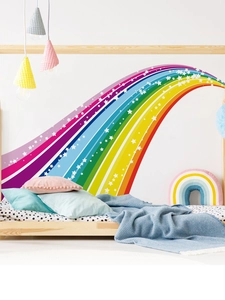 Detail showing a large colorful rainbow wall sticker with stars in a cozy child's bedroom