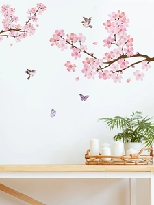Détails des stickers muraux fleurs de cerisier avec oiseaux et papillons dans un salon