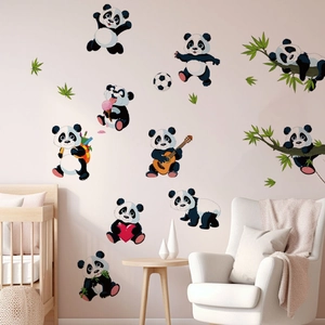Nursery wall display featuring ten cute panda decals with bamboo leaves in a cozy room