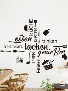 Detailed close-up of kitchen wall stickers showing black cookware icons and German text