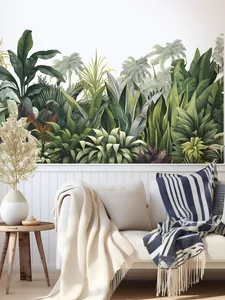 Detail of tropical forest wall mural with banana and palm leaves in a living room