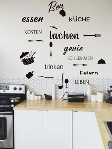 Detail of black PVC kitchen wall stickers with German text and utensil icons on white wall