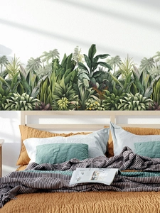 Detail of tropical palm leaf wall decals in hand-painted style for bedroom decoration