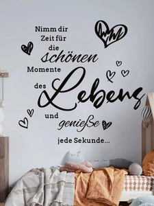 Detail view of German inspirational wall decal with heart patterns in a modern bedroom
