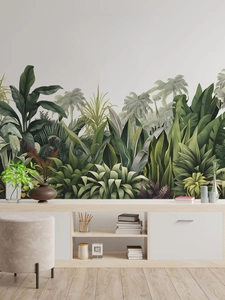 Close-up of tropical palm leaf wall decal above a wooden sideboard in a living room