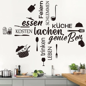 Modern black kitchen wall decals with German cooking quotes and utensil silhouettes