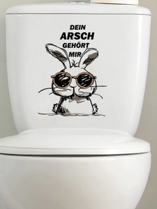 Funny bunny toilet sticker with German text Dein Arsch Gehört Mir on white ceramic surface