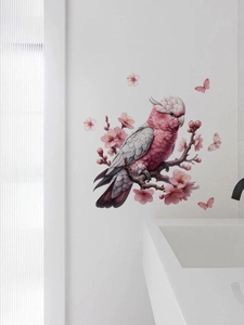 Detail of pink cockatoo wall sticker with cherry blossom branches and butterflies in bathroom