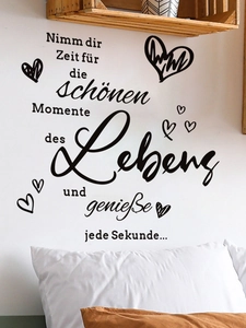 Detail of black vinyl wall decal with inspirational German quote and hand-drawn hearts