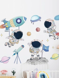 Detailed astronaut and rocket wall decals on white wall in cozy nursery bedroom setup