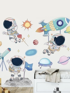 Detailed view of cartoon astronaut and rocket wall stickers in a cozy child's bedroom