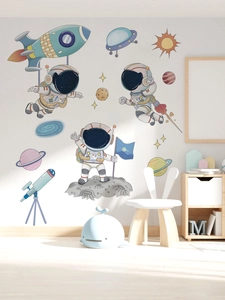Space themed wall decals with cute astronauts and rockets in a cozy nursery room setting