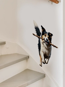 3D Australian Shepherd wall sticker holding a wooden stick on a white staircase wall