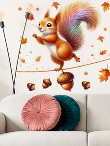 Cartoon squirrel and autumn leaves wall sticker displayed on a white wall above a sofa