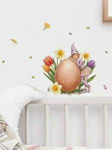 Detail of tulip fairy and Easter egg wall decal applied in a cozy nursery room