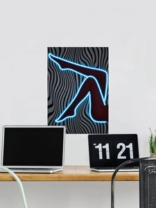 Detail of neon blue leg silhouette wall art with black and white wavy pattern background