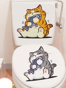 Detail of waterproof PVC toilet stickers featuring cute cartoon cats holding blue fish