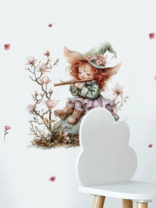 Detail of whimsical fairy girl wall sticker with pink flowers on white wall decor