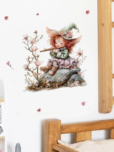 Detail view of fairy girl wall sticker with blooming flowers on white living room wall