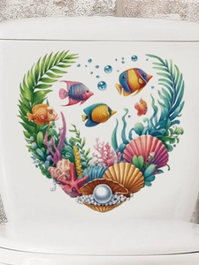 Detail of marine life wall stickers in a heart shape on a white toilet tank surface