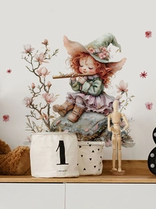 Detail of cartoon fairy girl playing flute wall decal with pink magnolia flower accents