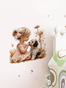 Détail du sticker mural d'une fille embrassant un chiot sur un mur blanc de chambre