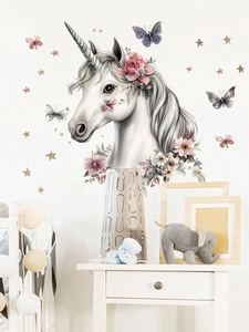 Detail of watercolor unicorn wall sticker with pink flowers and gold stars for nursery