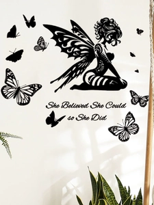 Detail of PVC wall decal with fairy silhouette and butterflies on a white home wall