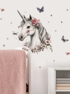 Detailed watercolor unicorn wall sticker with butterflies and stars in a nursery